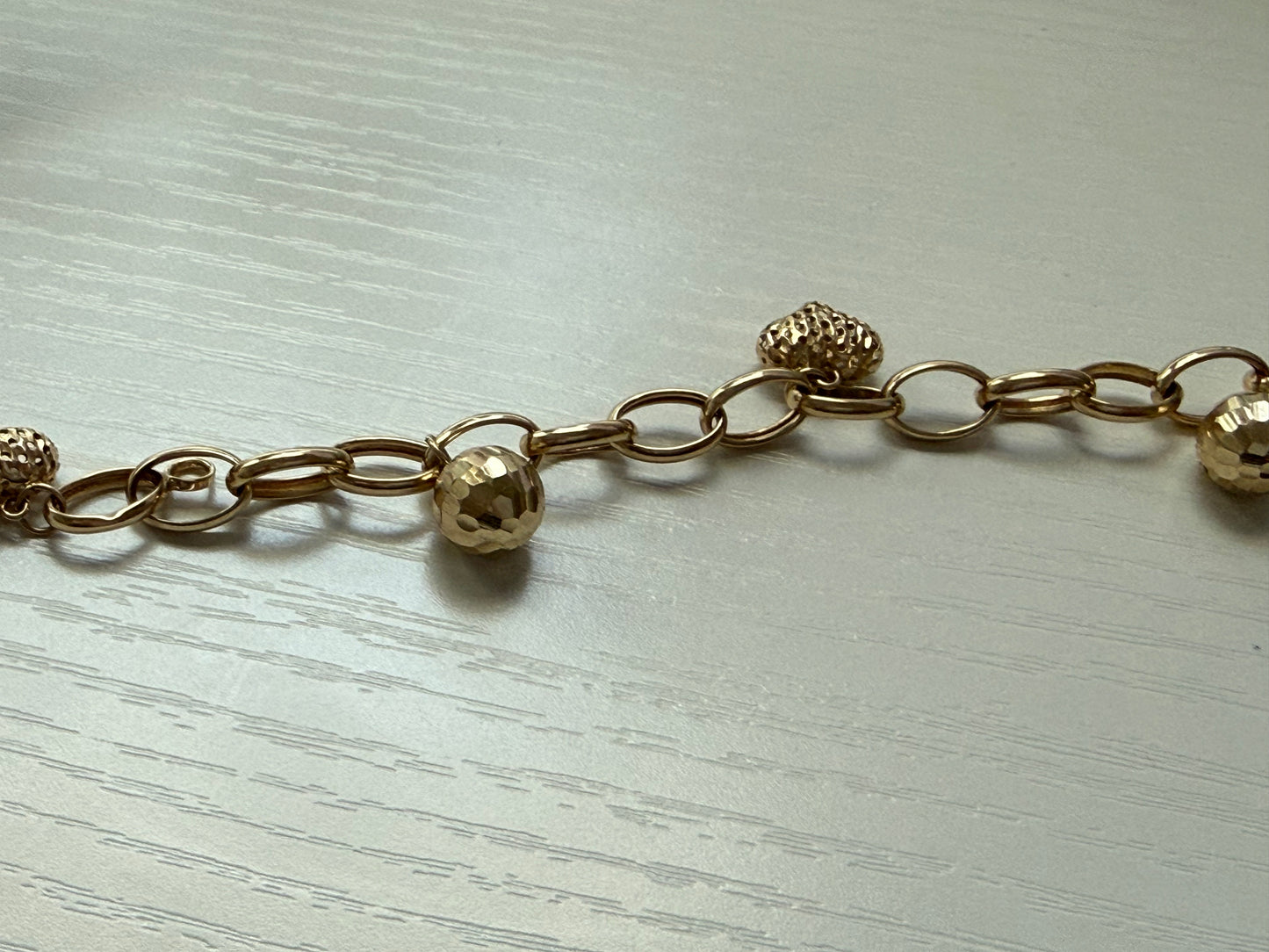 Brazalete de 14 k con colgante